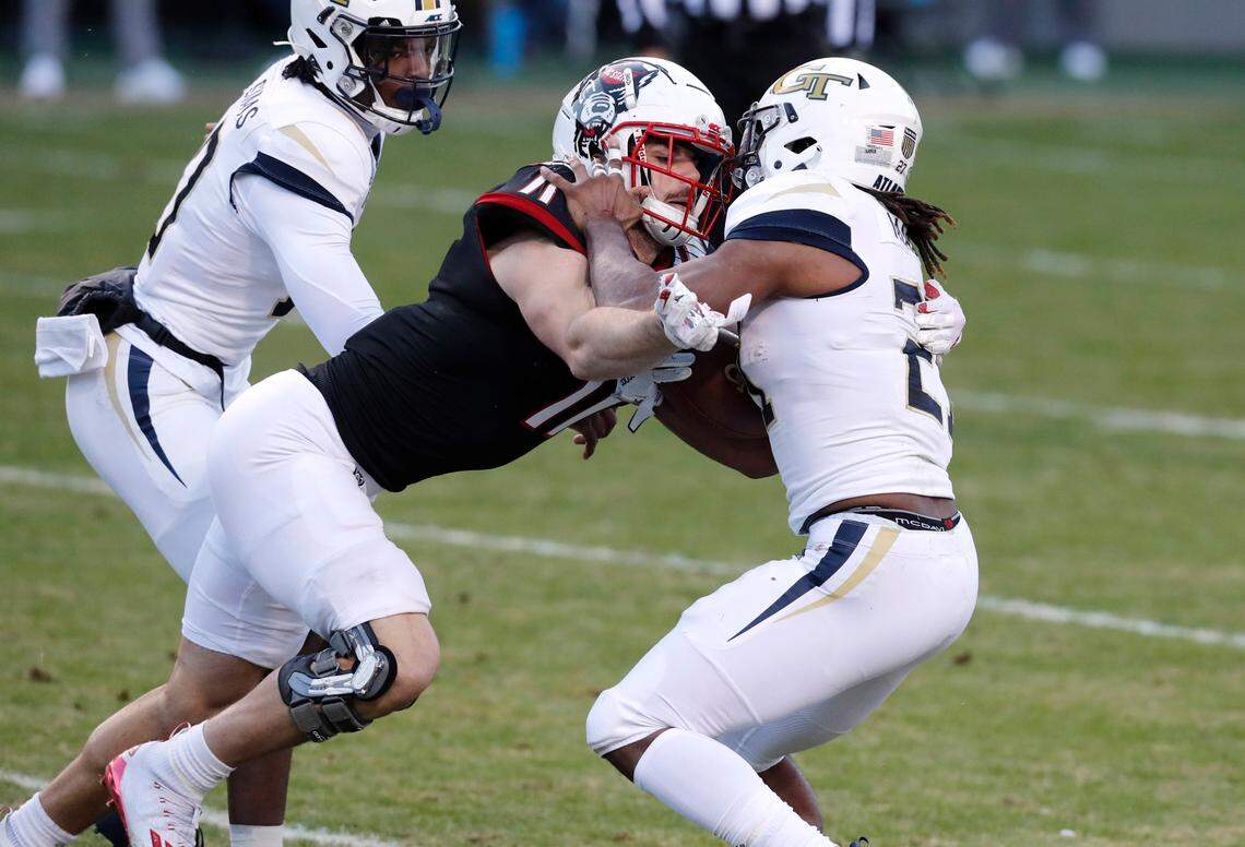 N.C. State linebacker Payton Wilson (11) tackles Georgia Tech running back Jordan Mason (27) for a loss during the first half of N.C. State’s game against Georgia Tech at Carter-Finley Stadium in Raleigh, N.C., Saturday, Dec. 5, 2020.