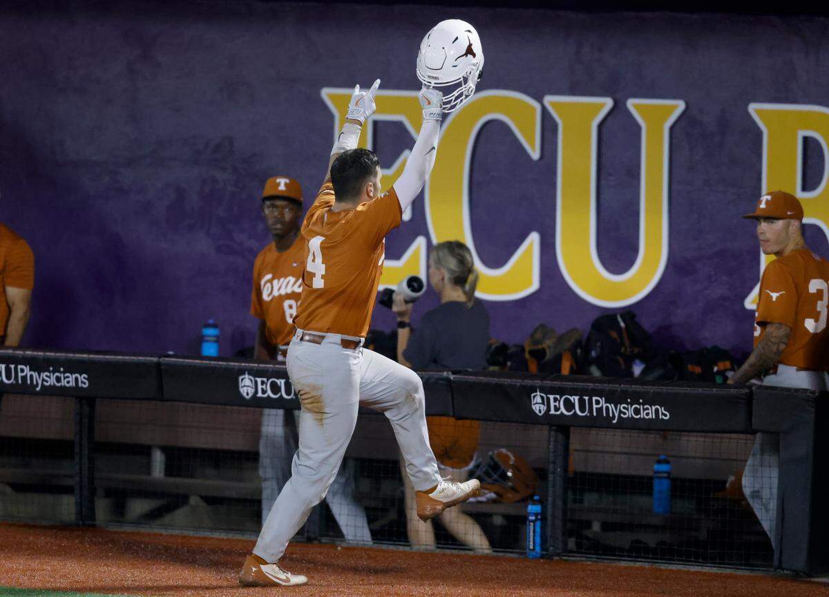 Texas’ Silas Ardoin (4) acknowledges the fans after hitting a solo homerun in the ninth inning during Texas’ 11-1 victory over ECU to win the Greenville Super Regional at Clark-LeClair Stadium early Monday morning, June 13, 2022.