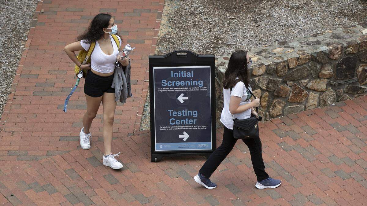 University of North Carolina students enter the Campus Health Building for COVID-19 testing in August 2020. Last fall, UNC-CH had to cancel in-person classes and close dorms after COVID cases rose. This fall, the UNC System is recommending students get vaccinated but not requiring it.