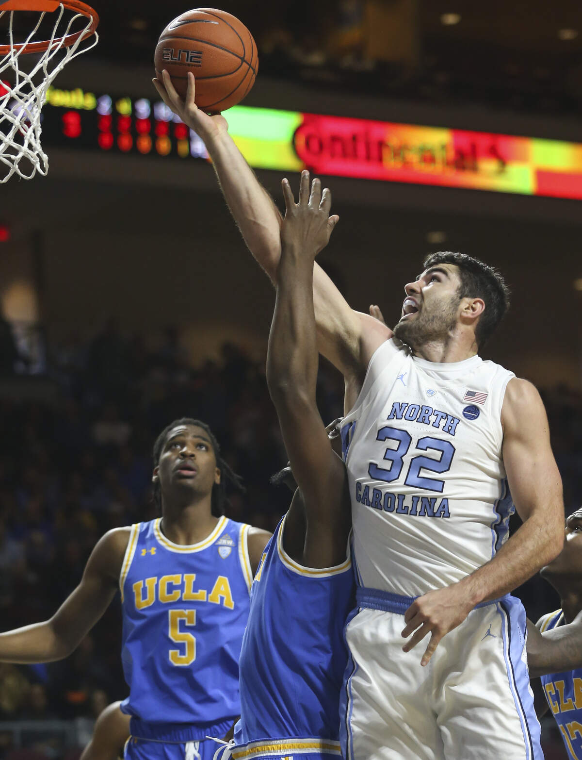 North Carolina’s Luke Maye (32) shoots over UCLA’s Cody Riley during the first half Friday, Nov. 23, 2018, in Las Vegas.