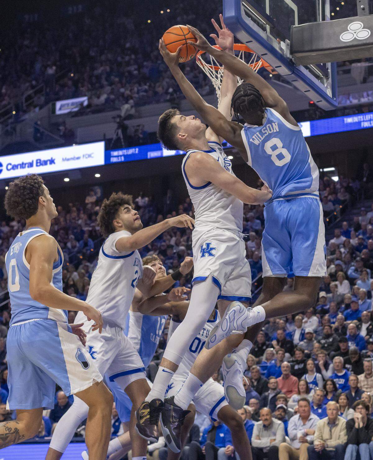 North Carolina forward Caleb Wilson (8) drives to the basket against Kentucky forward Andrija Jelavic (4) in the second half on Tuesday, December 2, 2025 at Rupp Arena in Lexington, Ky.