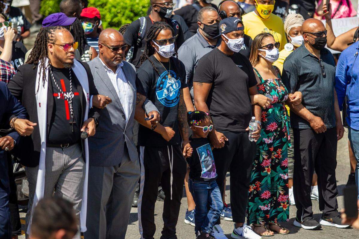 Hundreds of demonstrators led by Andrew Brown Jr.s family and Rev. Greg Drumwright, march Sunday, May 2, 2021 at the site where Brown was shot and killed by Pasquotank County Sheriff deputies. Browns funeral will be held Monday.