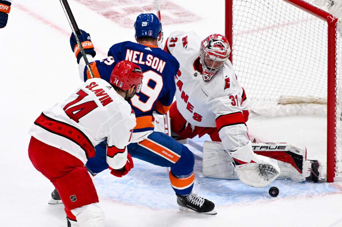 Apr 25, 2024; Elmont, New York, USA; Carolina Hurricanes goaltender Frederik Andersen (31) makes a save against the New York Islanders during the first period in game three of the first round of the 2024 Stanley Cup Playoffs at UBS Arena. Mandatory Credit: Dennis Schneidler-USA TODAY Sports
