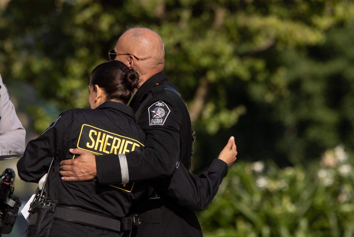 Law enforcement members greet one another prior to a memorial service for K9 Santos, a Wake County sheriff’s dog, at the Kerr Scott Building on Wednesday, June 14, 2023, in Raleigh, N.C. K9 Santos, a German shepherd, was accidentally shot and killed by a Knightdale police officer after a traffic stop in May.
