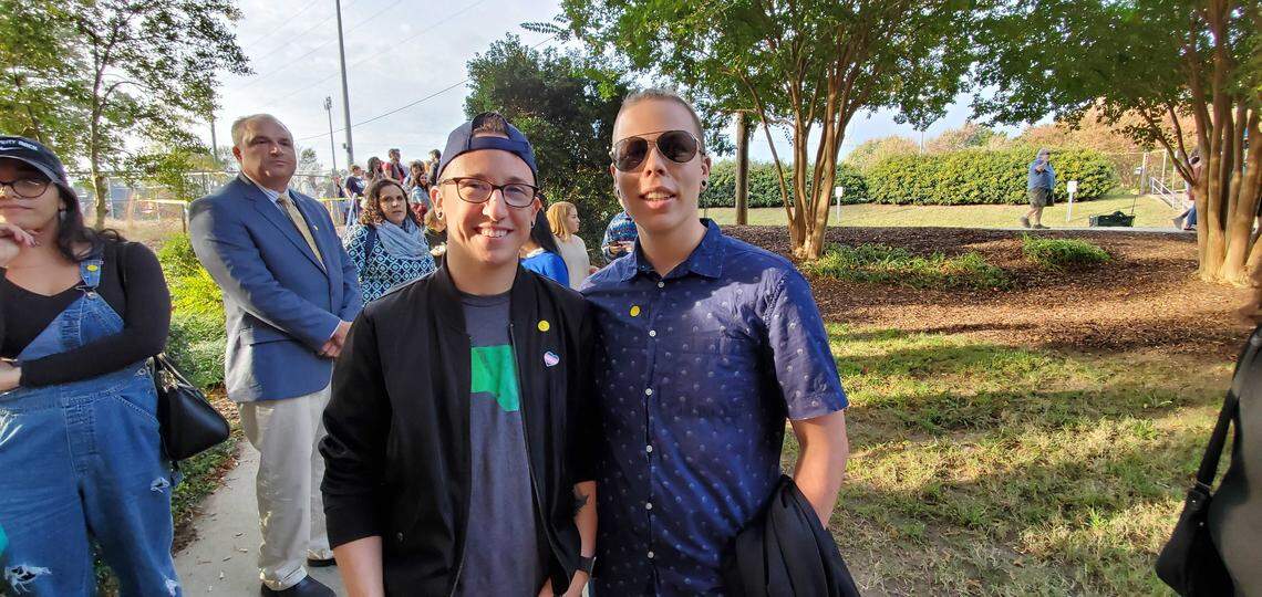 Kori Hennessey, left, and Jordan Manus, both from Apex, attend a rally for Elizabeth Warren at Broughton High School in Raleigh on Thursday, Nov. 7, 2019.