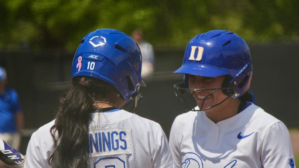 Duke outfielder D’Auna Jennings (10) and infielder Ana Gold (4) talk between innings during the Blue Devils’ 6-5 loss to Notre Dame on Saturday, April 19, 2025, at Duke Softball Stadium in Durham, N.C.