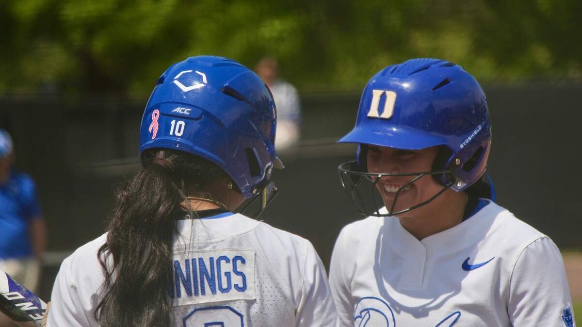 Duke outfielder D’Auna Jennings (10) and infielder Ana Gold (4) talk between innings during the Blue Devils’ 6-5 loss to Notre Dame on Saturday, April 19, 2025, at Duke Softball Stadium in Durham, N.C.