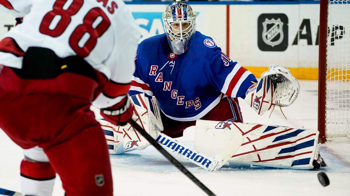 New York Rangers goaltender Igor Shesterkin (31) makes a save against Carolina Hurricanes center Martin Necas (88) in the third period of Game 4 of an NHL hockey Stanley Cup second-round playoff series, Tuesday, May 24, 2022, in New York. The Rangers won 4-1.