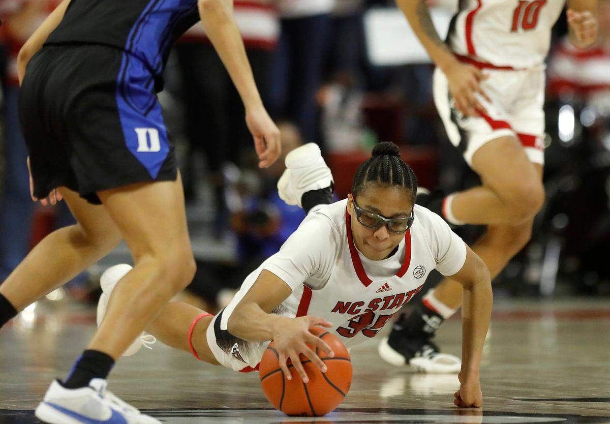 N.C. State’s Zoe Brooks dives on the floor during the second half of the Wolfpack’s 72-57 win over Duke on Sunday, Jan. 21, 2024, at Reynolds Coliseum in Raleigh, N.C.