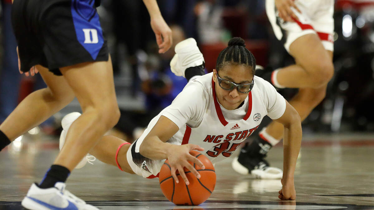 N.C. State’s Zoe Brooks dives on the floor during the second half of the Wolfpack’s 72-57 win over Duke on Sunday, Jan. 21, 2024, at Reynolds Coliseum in Raleigh, N.C.