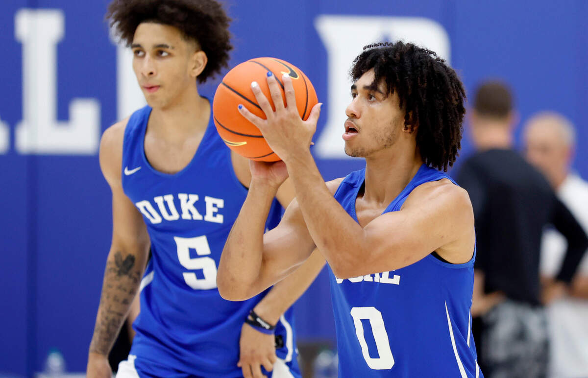 Duke’s Jared McCain (0) prepares to shoot during the Blue Devils’ workout at the K Center practice courts in Durham, N.C., Wednesday, July 12, 2023. Duke’s Tyrese Proctor (5) stands behind him.