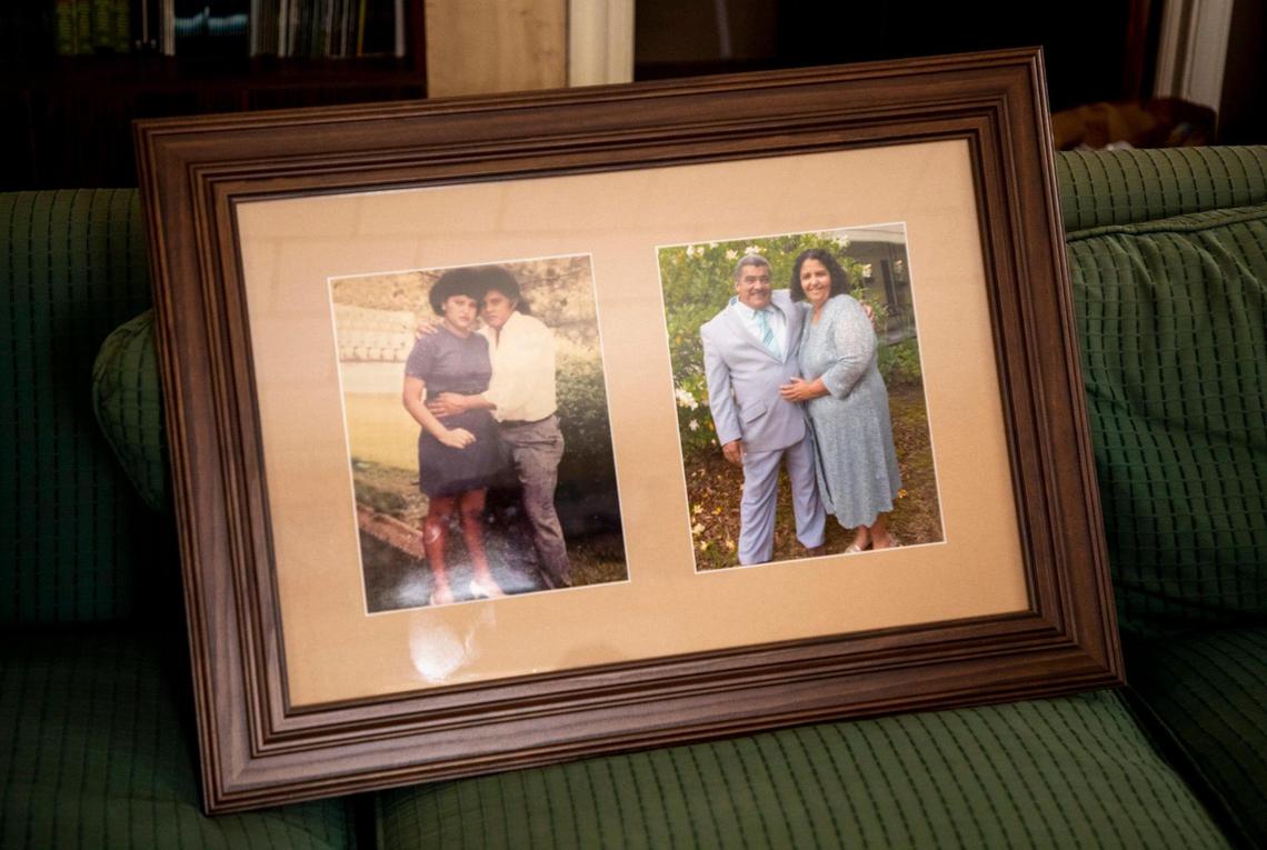 Framed photos of JosŽ Chicas and his wife are removed from the wall as he starts to pack his belongings the day before leaving the School for Conversion where he has spent the last three years and seven months in sanctuary from deportation, on Thursday, Jan. 21, 2021, in Durham, N.C.