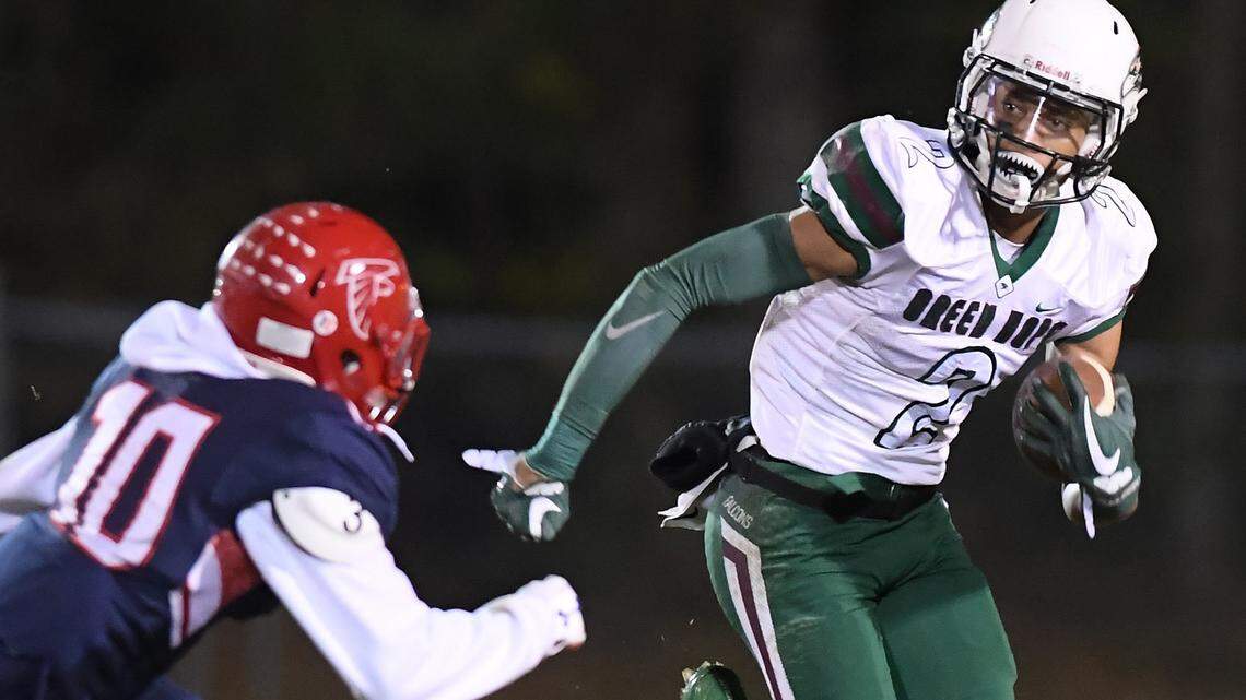 Jordyn Adams (2) of Green Hope moves the ball against the pursuit of Myles Speller (10) of Jordan. The Green Hope Falcons visited the Jordan Falcons in a high school football game on Oct. 27, 2017. Green Hope won 48-20.