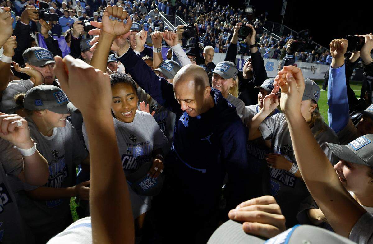 North Carolina interim head coach Damon Nahas huddles with the team after UNC’s 1-0 victory over Wake Forest in the finals of the 2024 Women’s College Cup at WakeMed Soccer Park in Cary, N.C., Monday, Dec. 9, 2024.