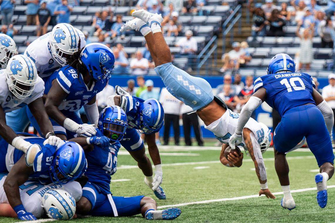 North Carolina running back Omarion Hampton dives over the pile for a touchdown in the second half of an NCAA college football game against Georgia State Saturday, Sept. 10, 2022, in Atlanta.