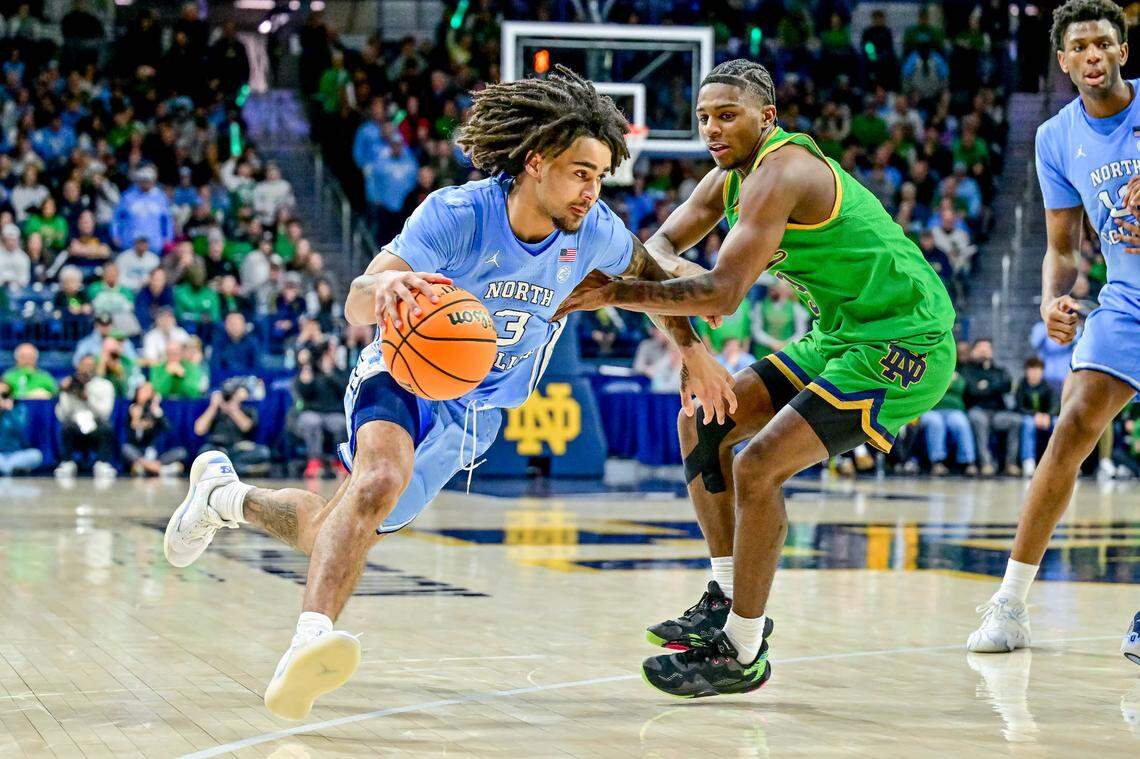 North Carolina Tar Heels guard Elliot Cadeau (3) drives to the basket as Notre Dame Fighting Irish guard Markus Burton (3) defends in the second half at the Purcell Pavilion.