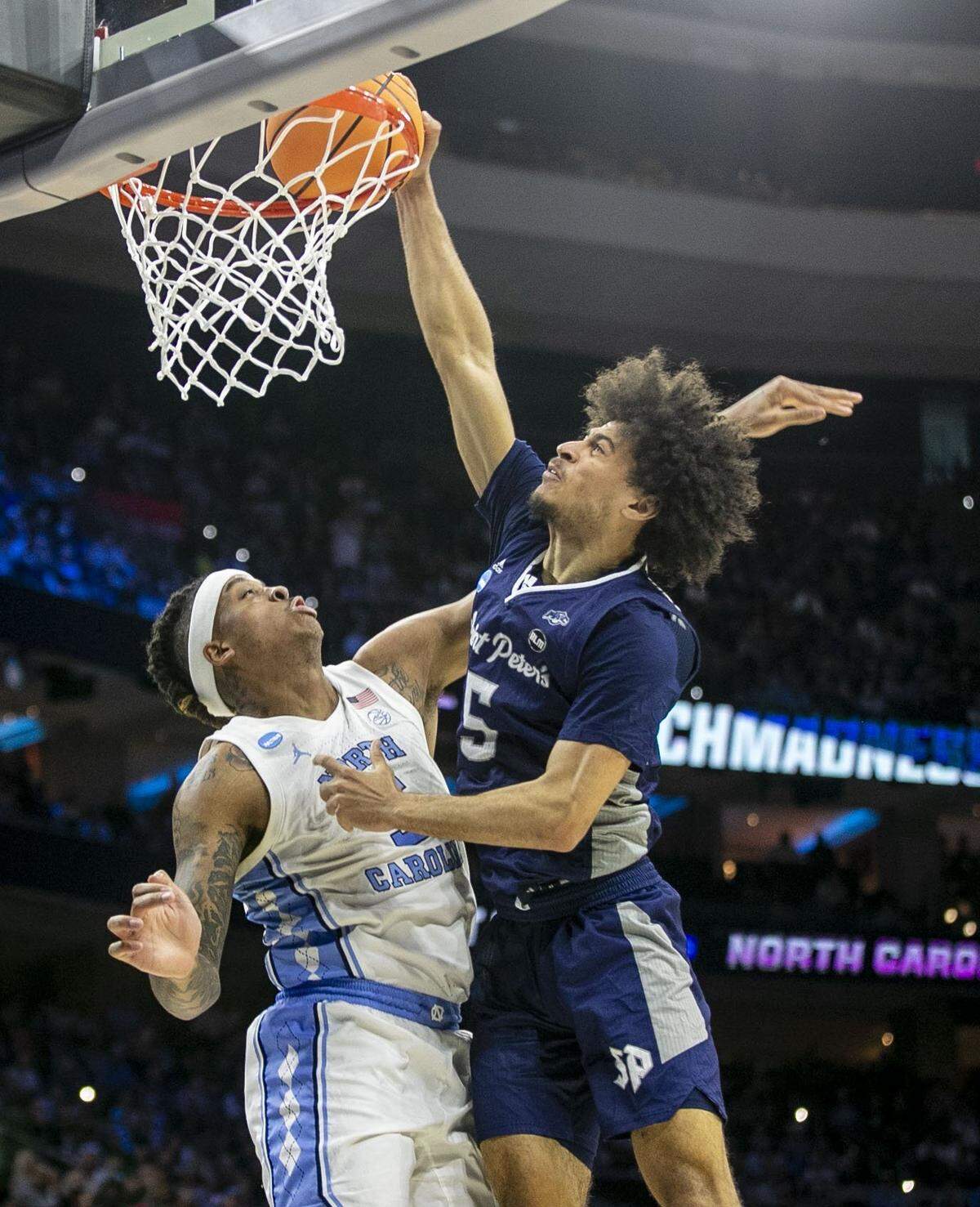 Saint Peters’ Daryl Banks III (5) misses a dunk against North Carolinas Armando Bacot (5) in the first half during the NCAA East Regional final on Sunday, March 27, 2022 at Wells Fargo Center in Philadelphia, Pa.