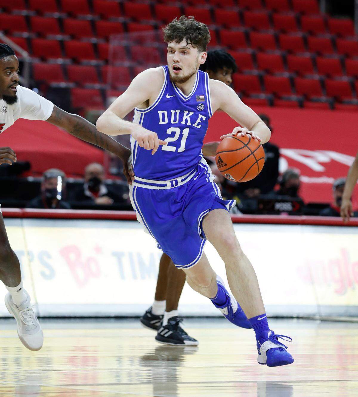 Duke’s Matthew Hurt (21) drives around N.C. State’s D.J. Funderburk (0) during the second half of Duke’s 69-53 victory over N.C. State at PNC Arena in Raleigh, N.C., Saturday, February 13, 2021.