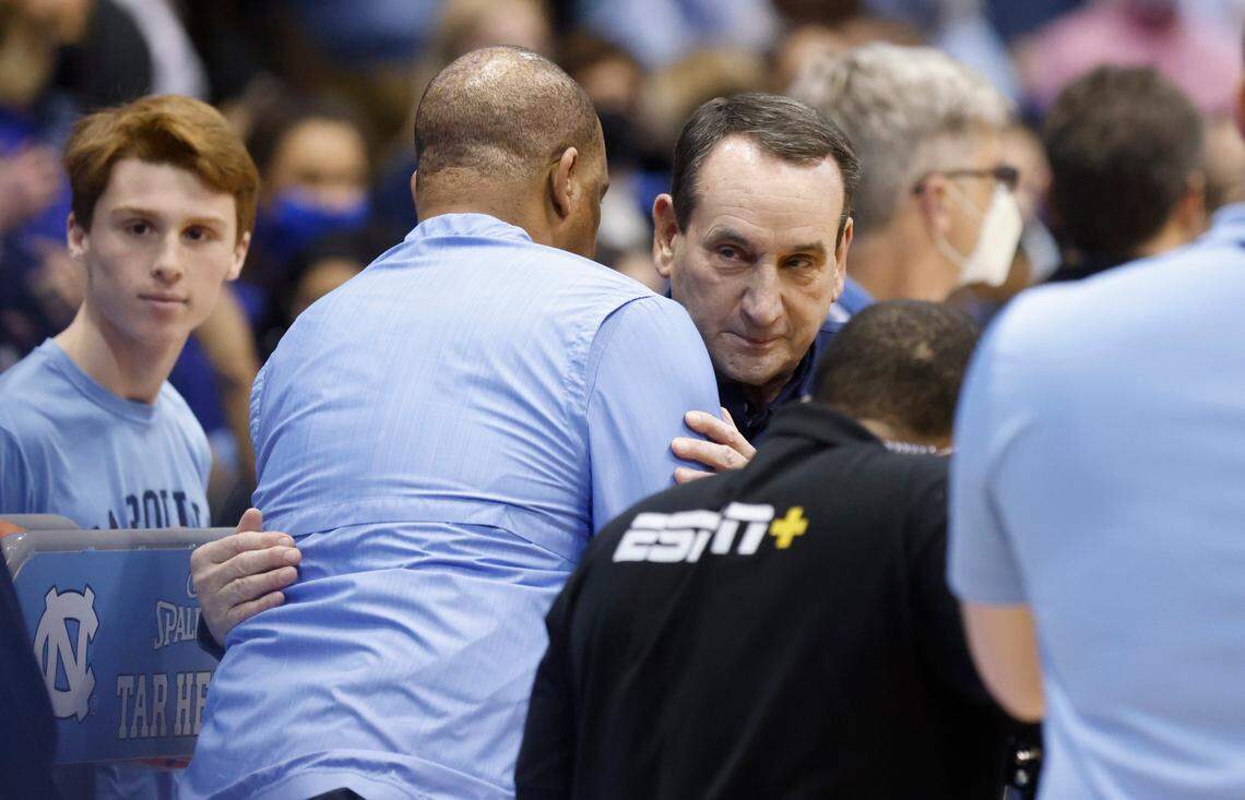 North Carolina head coach Hubert Davis greets Duke head coach Mike Krzyzewski before UNCs game against Duke at the Smith Center in Chapel Hill, N.C., Saturday, Feb. 5, 2022.