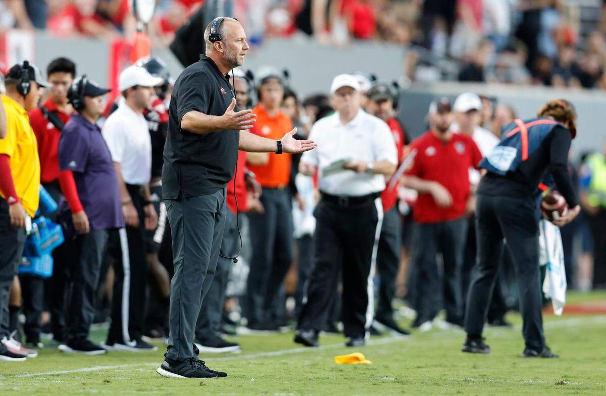 N.C. State head coach Dave Doeren questions the penalty call during the first half of N.C. States game against Texas Tech at Carter-Finley Stadium in Raleigh, N.C., Saturday, Sept. 17, 2022.