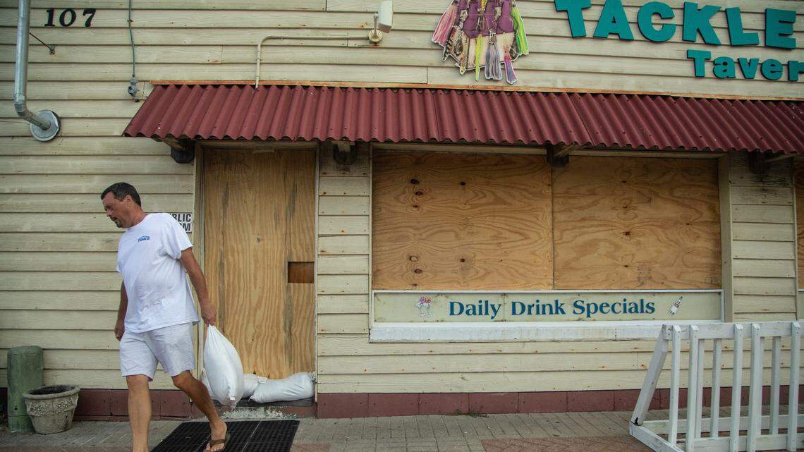 Morehead City Mayor Pro Tempore Richard Porter places sandbags around the Tackle Box Tavern in Atlantic Beach. The bar which boasts that it stays open 365 days per year closed it’s doors Wednesday, Sept. 12, 2018 in anticipation of Hurricane Florence.