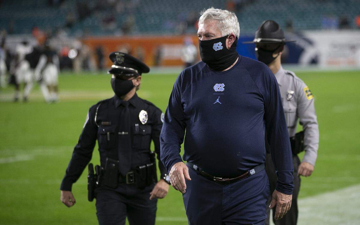 North Carolina coach Mack Brown leaves the field following the Tar Heels’ 41-27 loss to Texas A&M in the Capital One Orange Bowl on Saturday, January 2, 2021in Miami Gardens, Florida. 