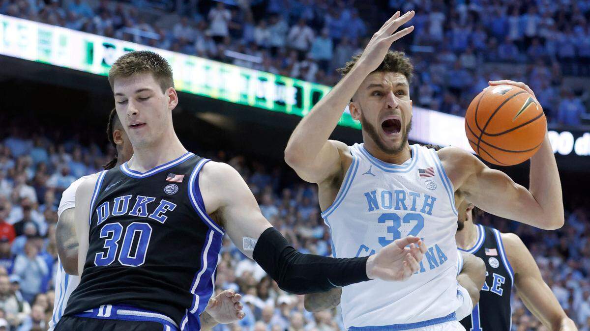 North Carolina’s Pete Nance (32) can’t believe he was called for the foul on Duke’s Kyle Filipowski (30) during the second half of Duke’s 62-57 victory over UNC at the Smith Center in Chapel Hill, N.C., Saturday, March 4, 2023.
