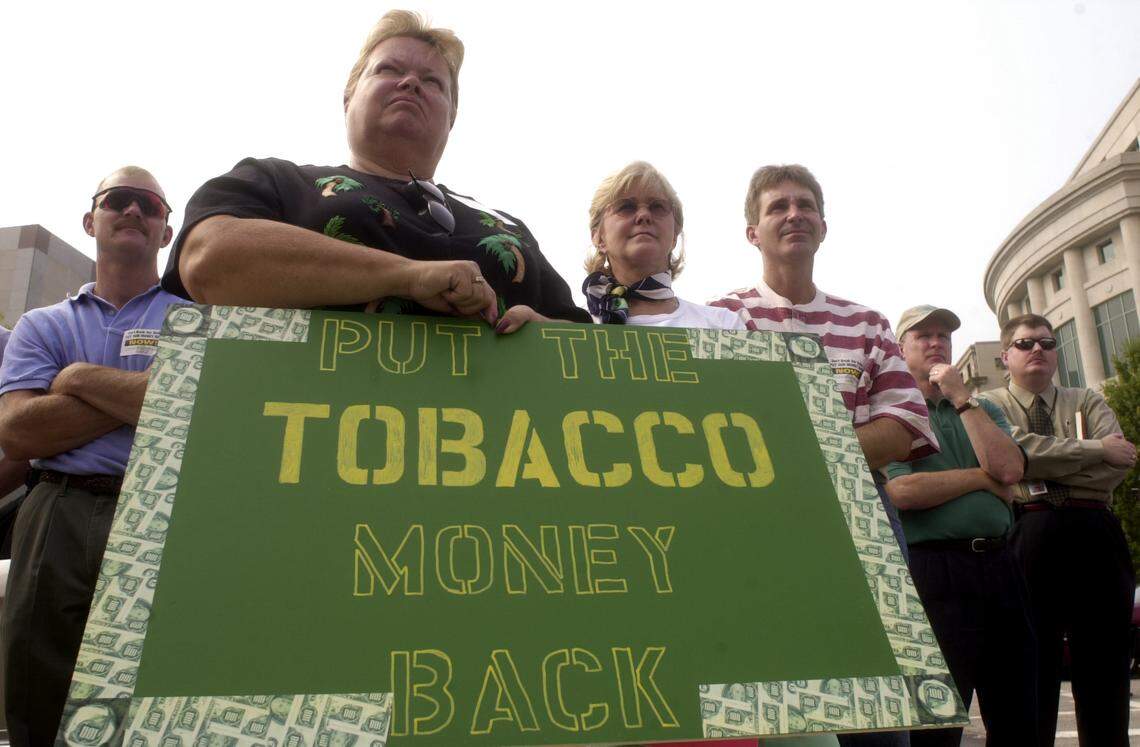 Linda Evans of Nash County, was one of about 60 tobacco farmers and their families, who gathered at a rally in 2002 in front of the Legislative Building in hopes of persuading the state to eventually pay back the $80 million Governor Easley has set aside from the national tobacco settlement to help balance the budget.