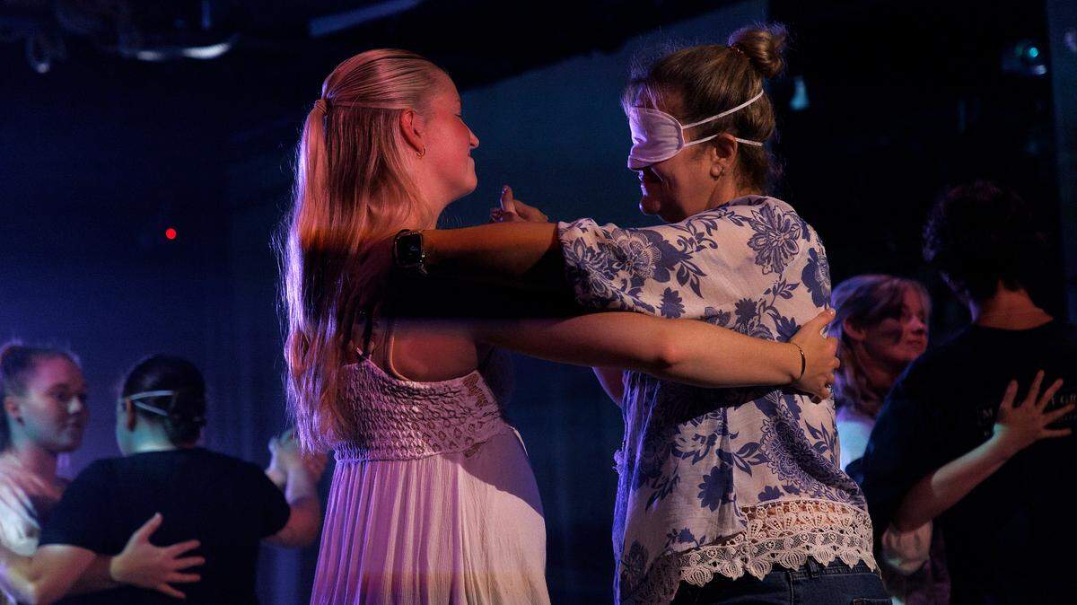 Phoebe Crumbine dances with Susan Bastien during a performance of “enVISION: The Next Chapter” on Thursday, July 25, 2024, at The Fruit in Durham, N.C. The show is designed for individuals who are low-hearing, low-vision, blind and deaf.