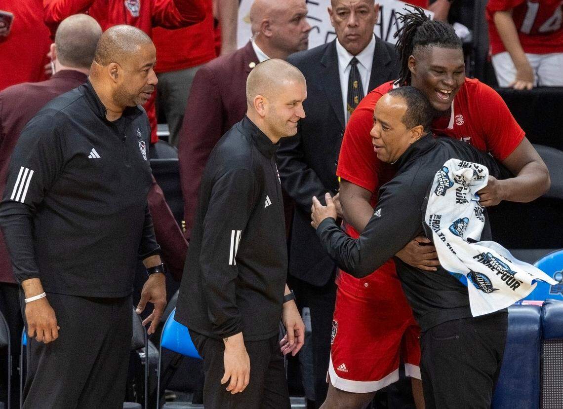 N.C. State’s D.J. Burns Jr. (30) embraces coach Kevin Keatts as the final second of the second half expire, celebrating the Wolfpack’s 76-64 victory over Duke on Sunday, March 31, 2024 at the American Airlines Center in Dallas, Texas.