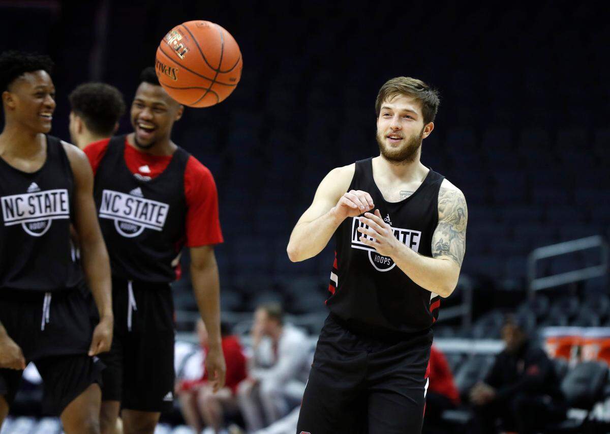 N.C. State’s Braxton Beverly smiles during the Wolfpack’s practice before the 2019 New York Life ACC Tournament at the Spectrum Center in Charlotte, N.C., Monday, March 11, 2019. N.C. State’s C.J. Bryce and Torin Dorn are to the left.