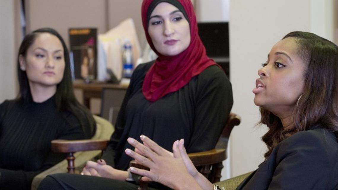 Tamika Mallory, right, co-chair of the Women’s March on Washington, talks during an interview with fellow co-chairs Carmen Perez, left, and Linda Sarsour, January 9, 2017 in New York.