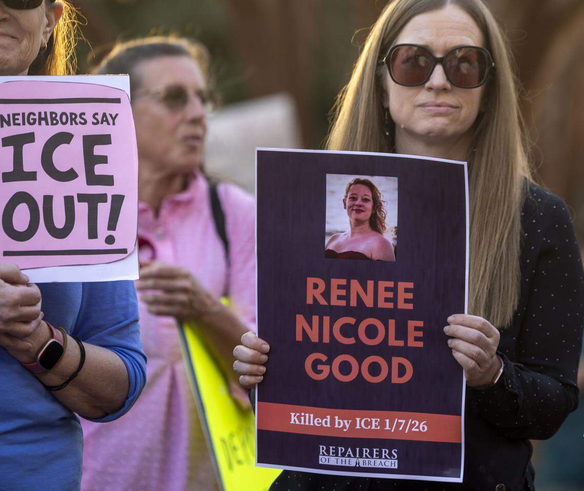 Heather Morgan of Cary, holds a photo of Renee Good during an anti-ICE demonstration outside Town Hall on Thursday, March 5, 2026 in Cary, N.C.  Good lost her life at the hands of ICE in Minneapolis, in January 2026. 