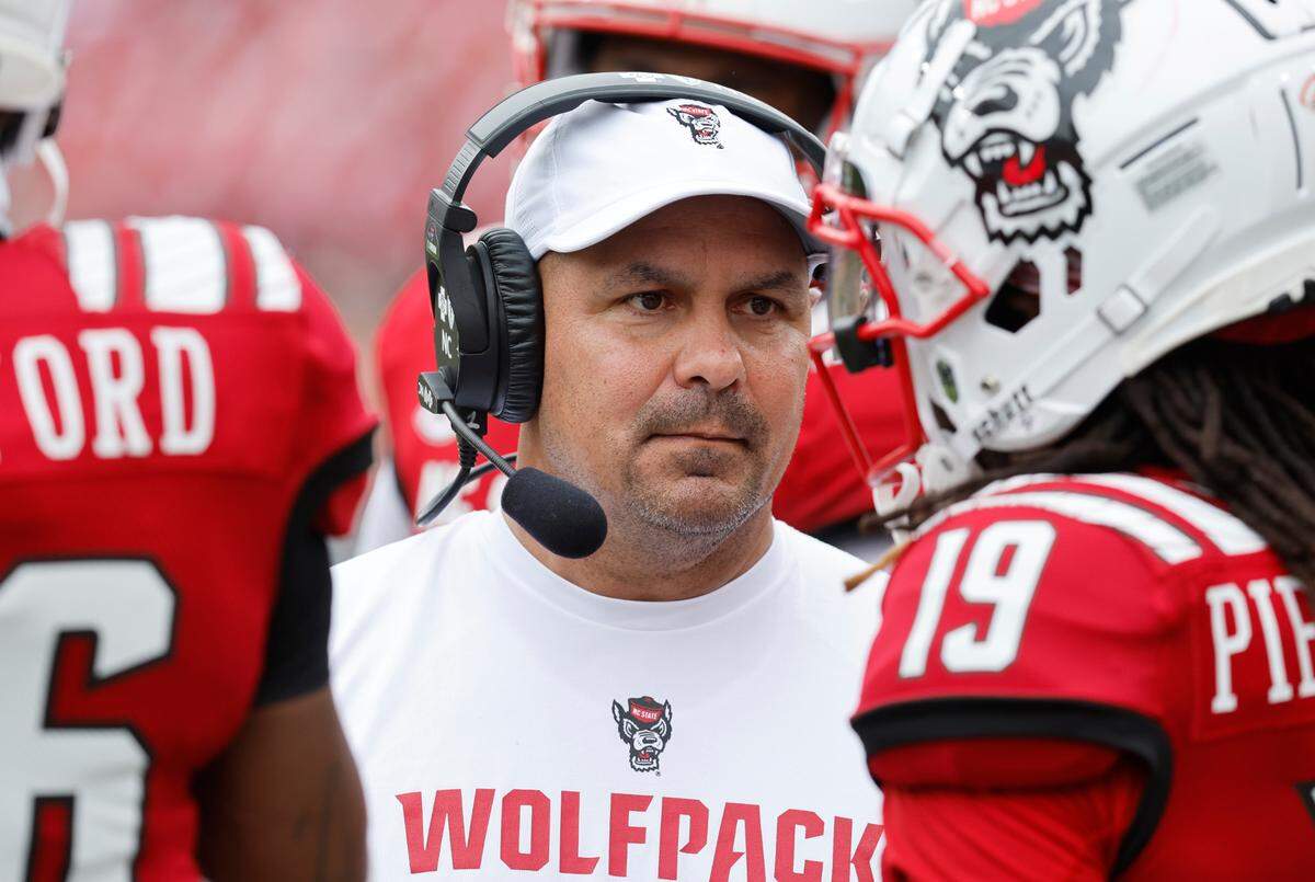 N.C. State defensive coordinator Tony Gibson talks with defensive back Joshua Pierre-Louis (19) during the second half of the Wolfpack’s 55-3 victory over Charleston Southern at Carter-Finley Stadium in Raleigh, N.C., Saturday, Sept. 10, 2022.