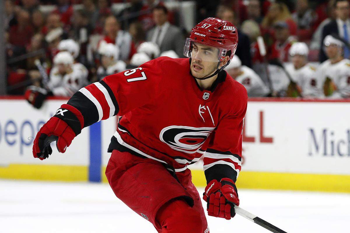 Carolina Hurricanes’ Trevor van Riemsdyk (57) eyes the puck against the Chicago Blackhawks during the third period of an NHL hockey game in Raleigh, N.C., Saturday, Oct. 26, 2019. (AP Photo/Karl B DeBlaker)