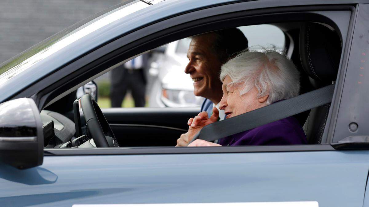 Gov. Roy Cooper plans to tout North Carolina’s success at landing clean energy manufacturing projects during the New York Times’ Climate forward conference Wednesday. Here, Cooper is shown laughing with Treasury Secretary Janet Yellen after she test drove an EV Ford Mustang Mach-E at Wake Technical Community College in Wendell Thursday, Sept. 5, 2024.
