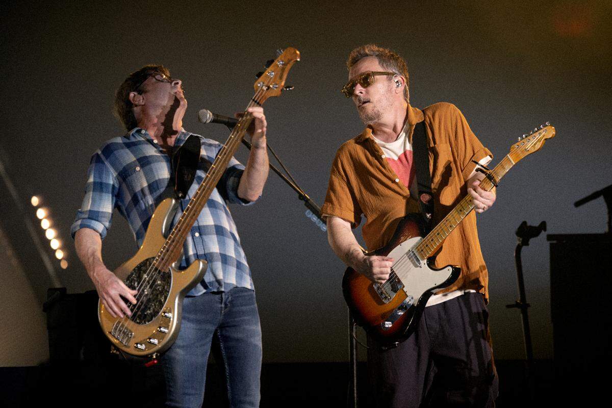 Matchbox 20’s Brian Yale (left) and Paul Doucette jam together during the band’s set at Raleigh, N.C.’s Coastal Credit Union Music Park at Walnut Creek, Wednesday night, July 12, 2023.