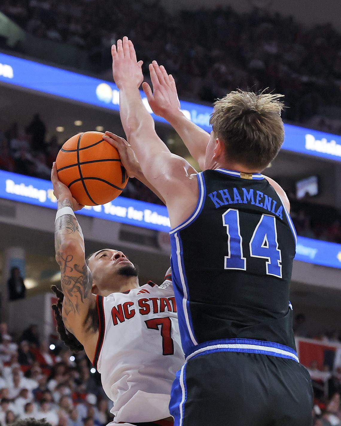 NC State's Alyn Breed looks to shoot over Duke’s Nikolas Khamenia during the second half of the Wolfpack’s 93-64 loss on Monday, March 2, 2026, at Lenovo Center in Raleigh, N.C. 