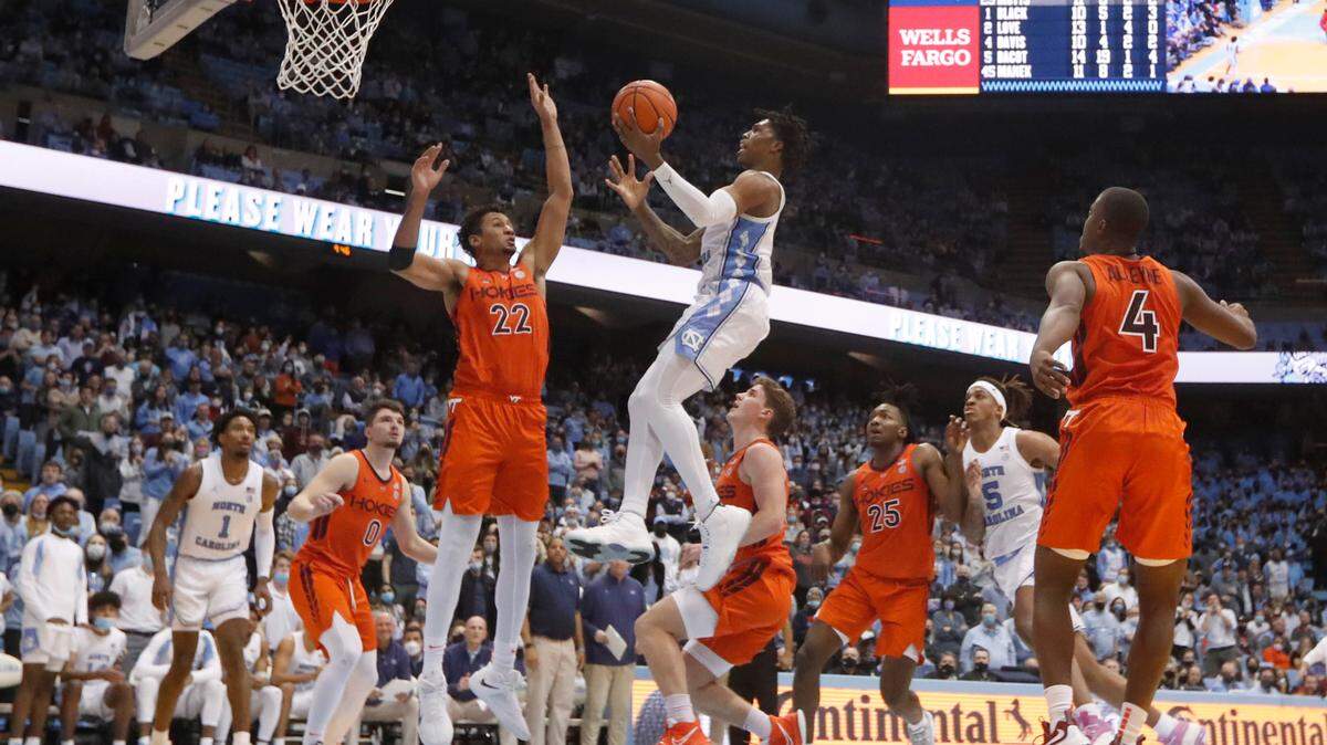 North Carolina’s Caleb Love (2) heads to the basket as Virginia Tech’s Keve Aluma (22) looks to defend during UNC’s 78-68 victory over Virginia Tech at the Smith Center in Chapel Hill, N.C., Monday, Jan. 24, 2022.