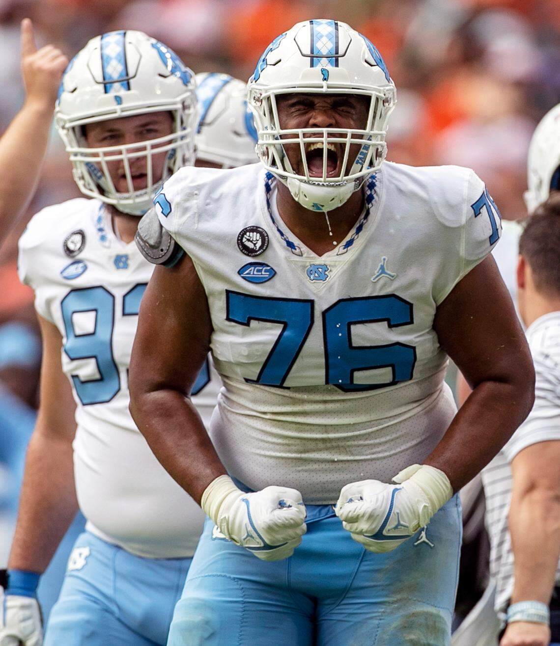 North Carolina’s William Barnes (76) reacts after a review of a play awarded a touchdown to North Carolina’s Omarion Hampton (28) on a two-yard run in the first quarter to give the Tar Heels’ a 14-0 lead over Miami on Saturday, October 8, 2022 at Hard Rock Stadium in Miami Gardens, Florida.