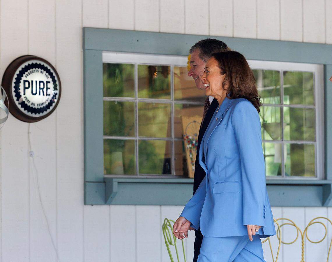 Vice President Kamala Harris and North Carolina Governor Roy Cooper walk into Bayleaf Market on Friday, Aug. 16, 2024, in Raleigh, N.C.