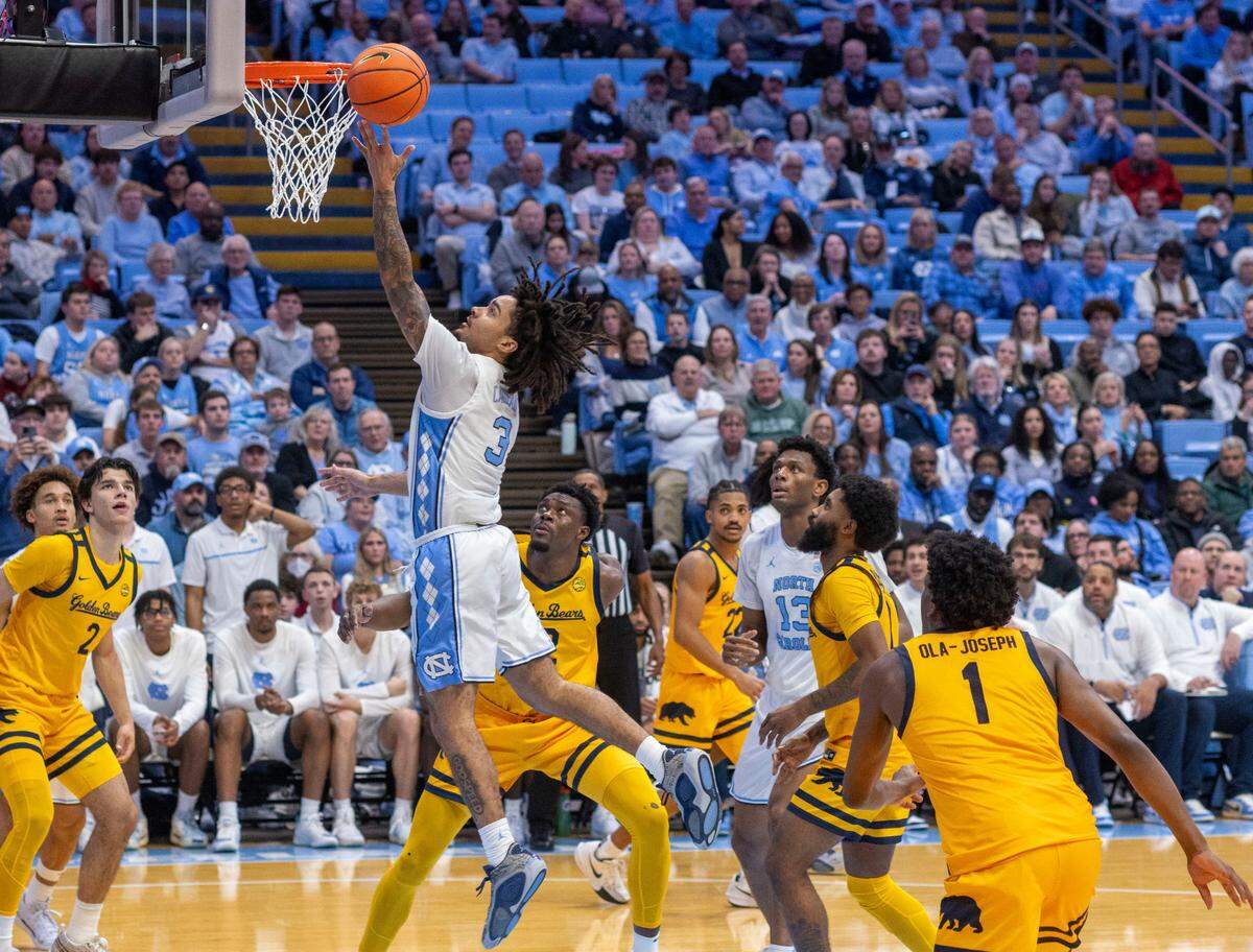 North Carolina guard Elliot Cadeau (3) drives to the basket against Cal’s Lee Dort (34) in the second half on Wednesday, January 15, 2025 at the Smith Center in Chapel Hill, N.C.