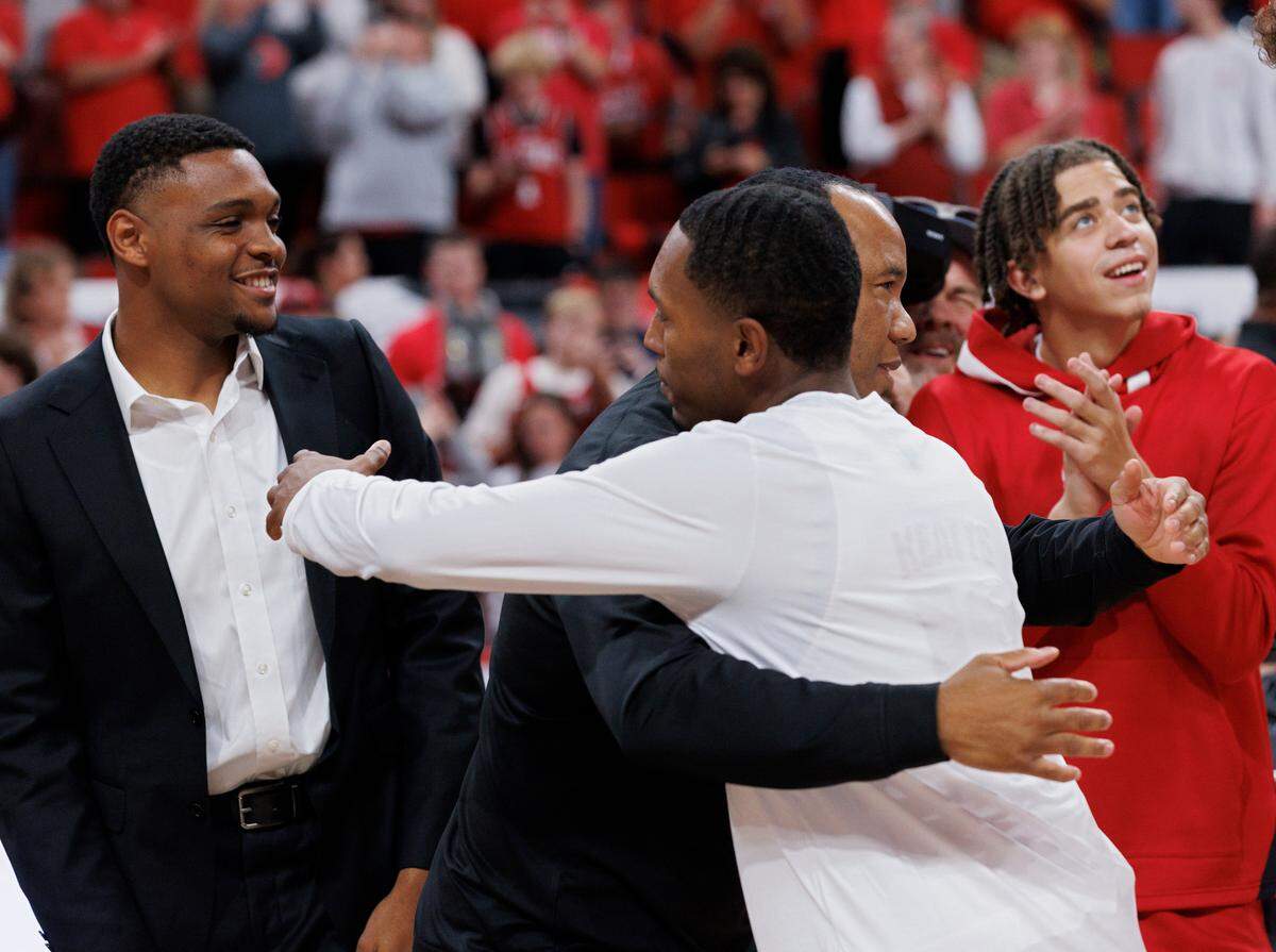 N.C. State head coach Kevin Keatts hugs K.J. Keatts during a banner ceremony to commemorate the Wolfpack’s 2024 NCAA Tournament Final Four appearance and ACC Tournament championship on Monday, Nov. 4, 2024, at Lenovo Center in Raleigh, N.C.