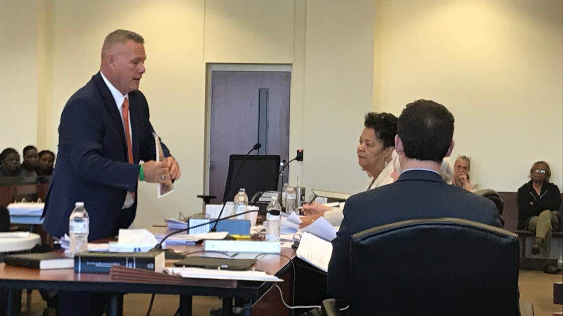 Jody Greene, the Republican candidate for Columbus County sheriff, shows the county board of elections an aerial photo of his Cerro Gordo property on April 4, 2019.
