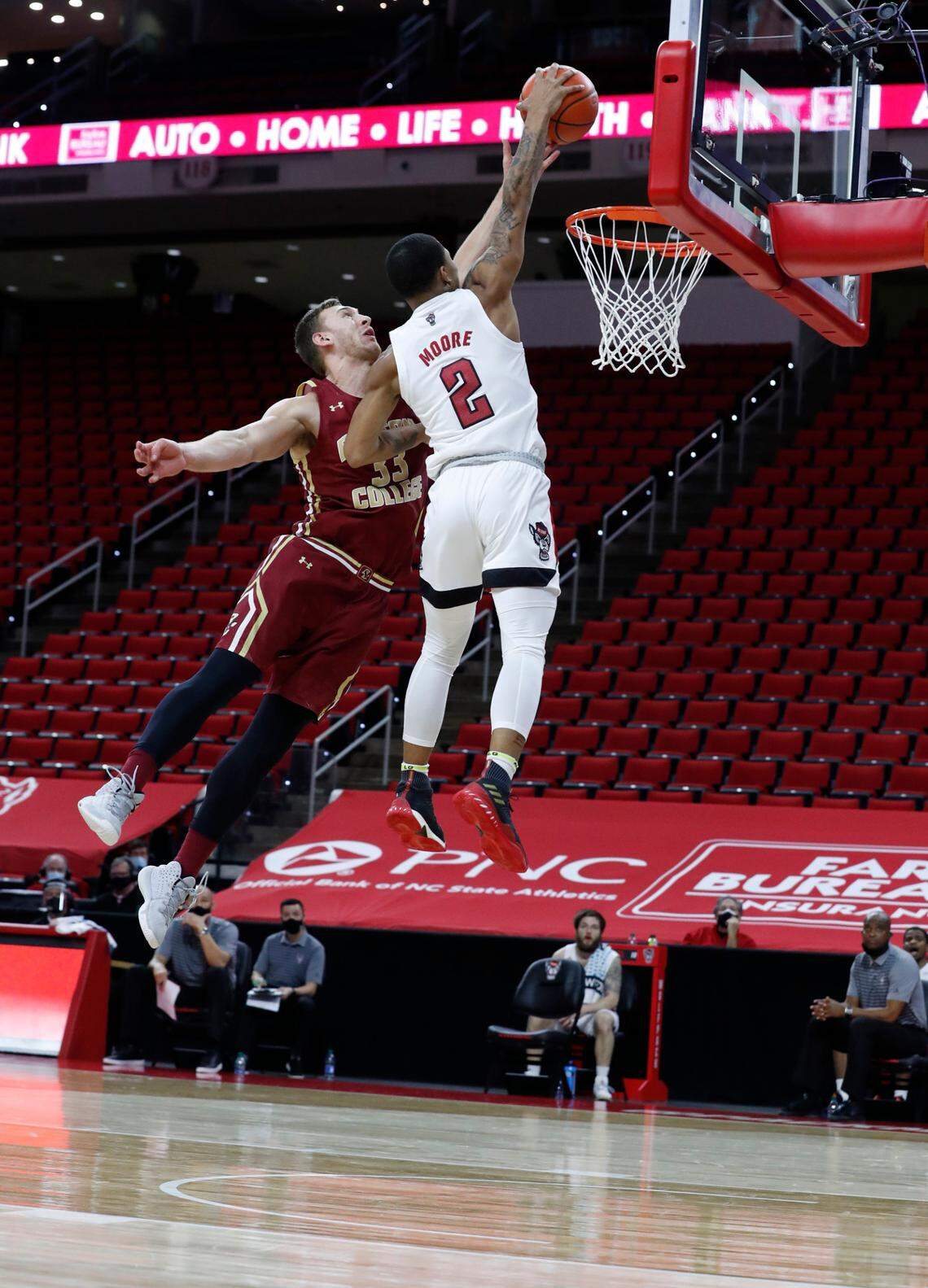 N.C. State’s Shakeel Moore (2) heads to the basket as Boston College’s James Karnik (33) looks to make the block during the second half of N.C. State’s 79-76 victory over Boston College at PNC Arena in Raleigh, N.C., Wednesday, December 30, 2020.