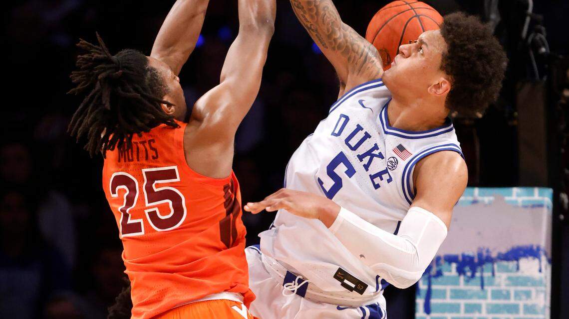 Virginia Tech’s Justyn Mutts (25) slams in two over Duke’s Paolo Banchero (5) during the second half of Virginia Tech’s 82-67 victory over Duke in the finals of the ACC men’s basketball tournament at the Barclays Center in Brooklyn, N.Y., Saturday, March 12, 2022.