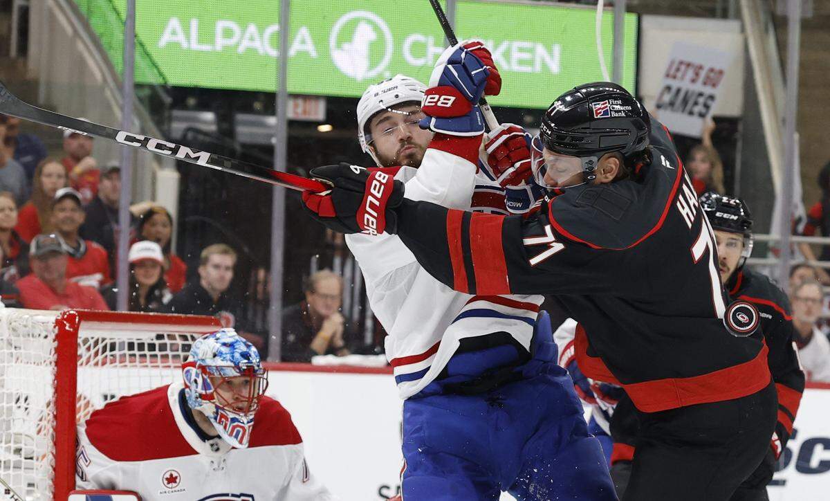 Carolina's Taylor Hall (71) checks Montréal's Noah Dobson (53) during the first period of the Hurricanes’ game against the Canadiens in game one of the Eastern Conference Finals at the Lenovo Center Thursday, May, 21, 2026.