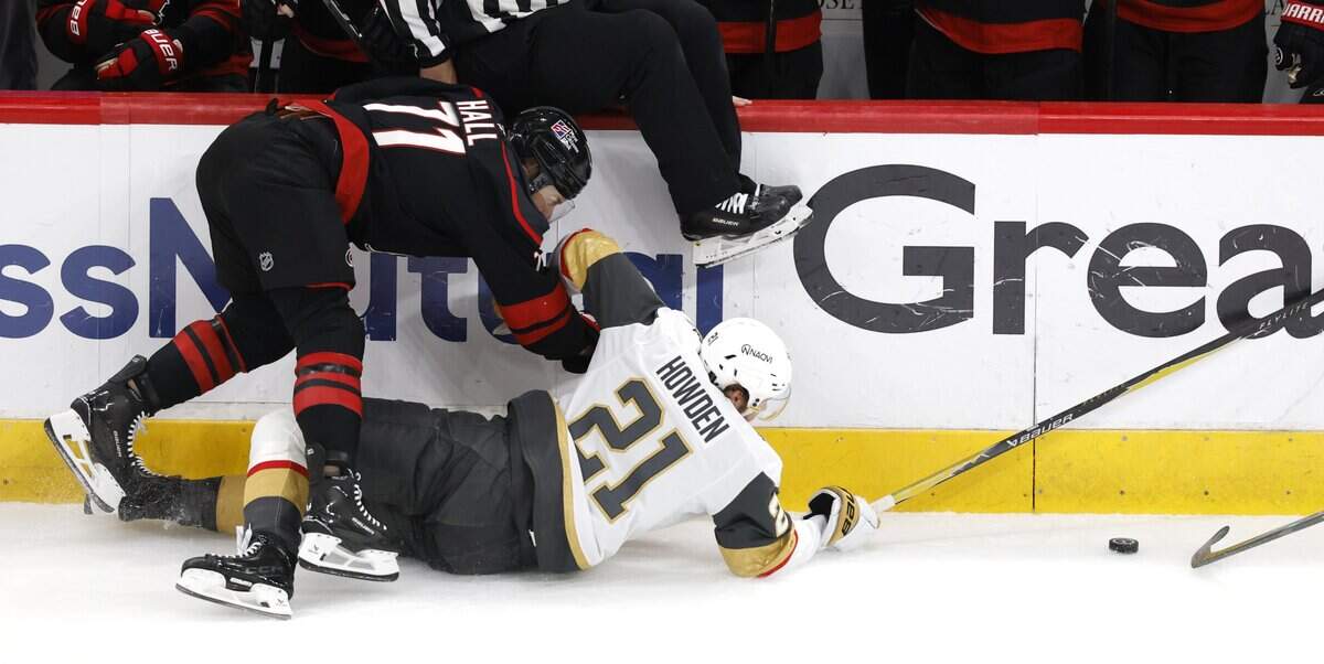 Carolina's Mark Jankowski (77) and Vegas’ Brett Howden (21) go after the puck in the first period of the Hurricanes’ game against the Golden Knights in the fifth game of the Stanley Cup Final at the Lenovo Center in Raleigh, N.C., Thursday, June 11, 2026.