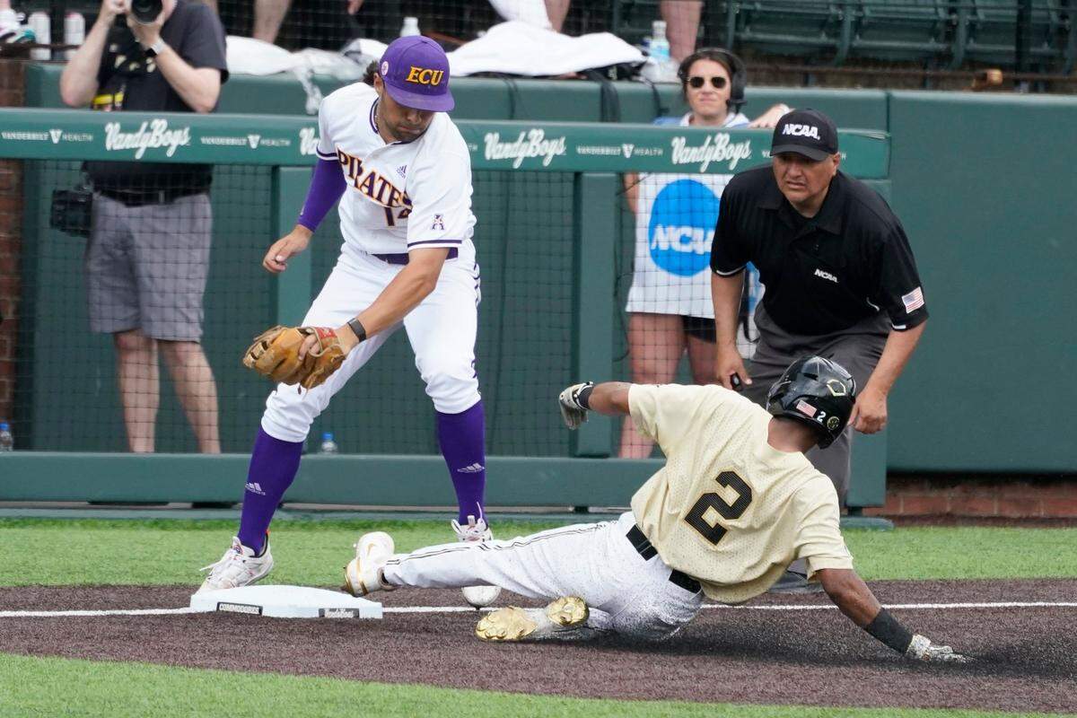 Vanderbilt’s Javier Vaz (2) steals third as East Carolina third baseman Zach Agnos takes the throw during the fifth inning of an NCAA college baseball super regional game Saturday, June 12, 2021, in Nashville, Tenn. (AP Photo/Mark Humphrey)