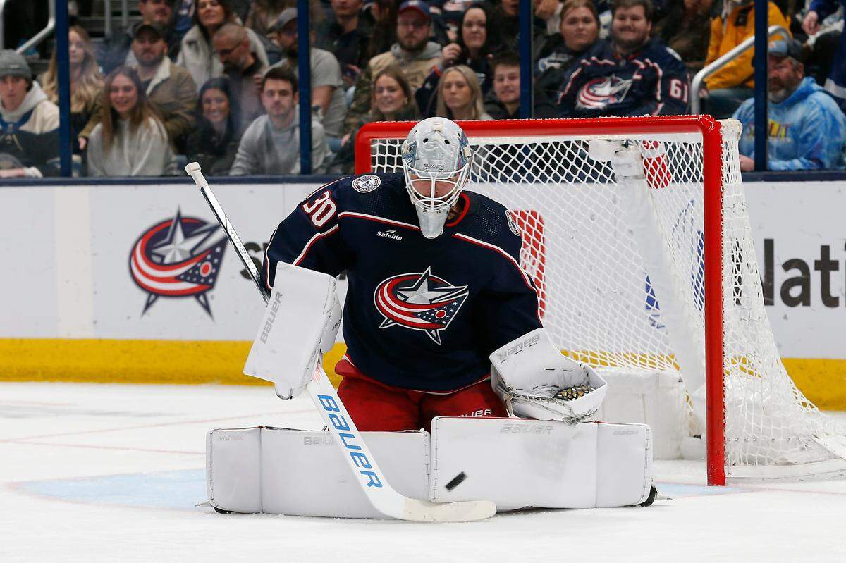 Dec 29, 2023; Columbus, Ohio, USA; Columbus Blue Jackets goalie Spencer Martin (30) makes a pad save against the Toronto Maple Leafs during the second period at Nationwide Arena. Mandatory Credit: Russell LaBounty-USA TODAY Sports